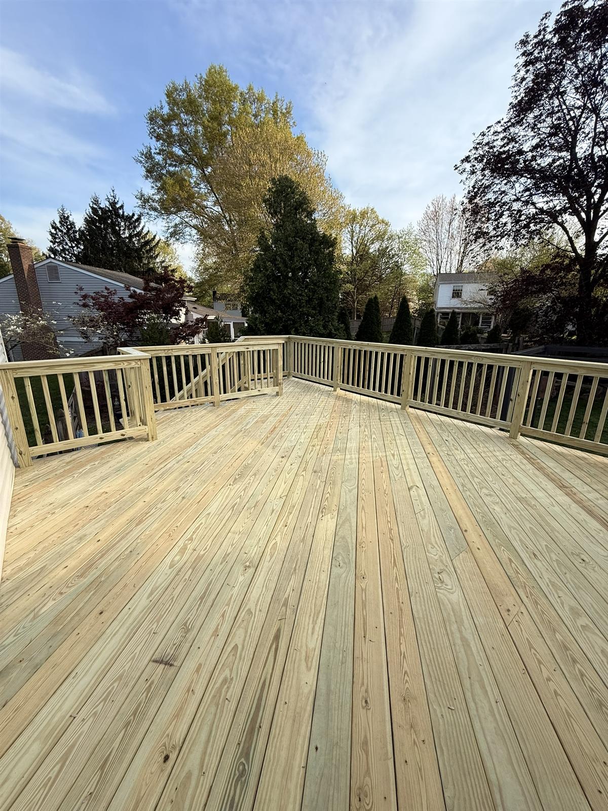 Finished wood deck built by DecKing Outdoor Living
